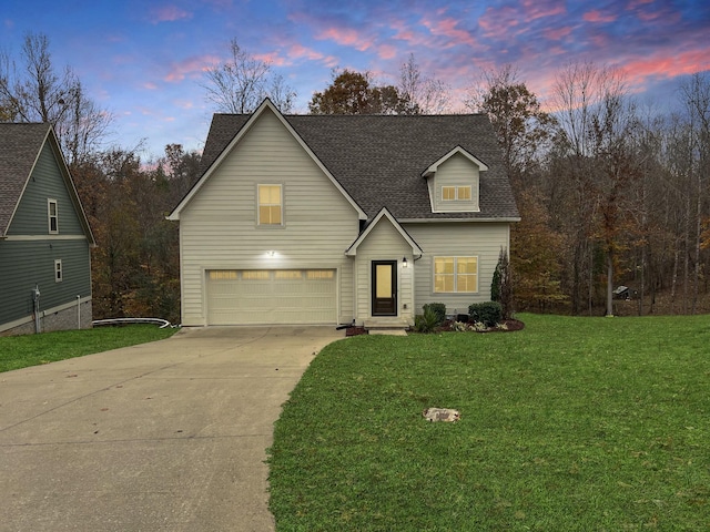 731 Hogan Rd, Clarksville, TN 37043 - traditional home with concrete driveway, a garage, a front yard, and roof with shingles