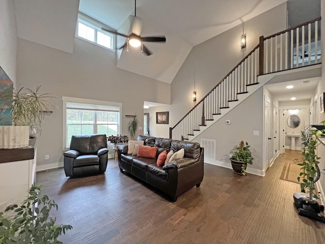 731 Hogan Rd, Clarksville, TN 37043 - living room with high vaulted ceiling, a ceiling fan, wood finished floors, stairway, and healthy amount of natural light