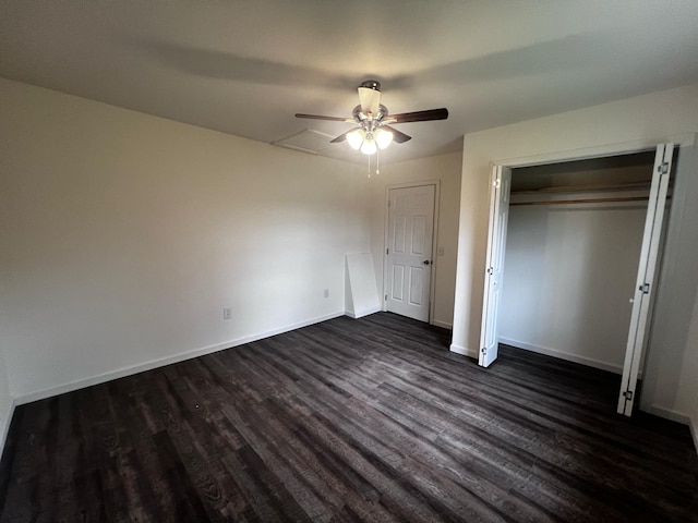 unfurnished bedroom featuring ceiling fan and dark hardwood / wood-style floors