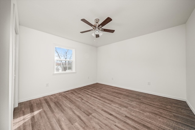 unfurnished room featuring ceiling fan and hardwood / wood-style floors