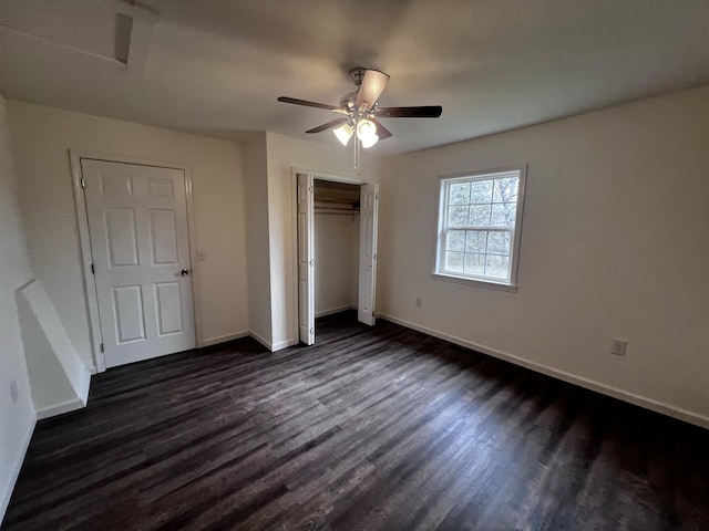 unfurnished bedroom featuring ceiling fan and dark hardwood / wood-style flooring