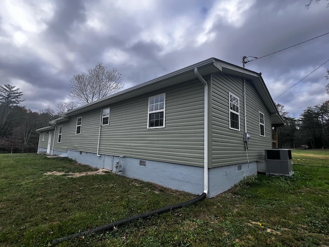 view of property exterior featuring a lawn