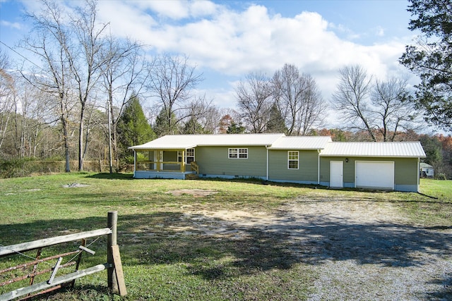 view of front facade with a front yard and a garage