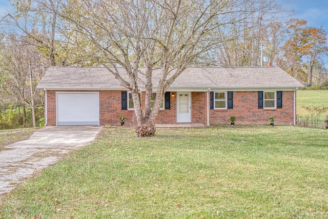 ranch-style home with a front yard and a garage