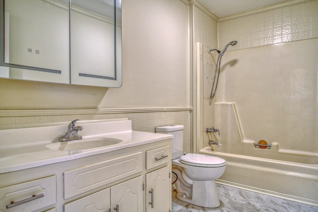 full bathroom featuring toilet, vanity, and tiled shower / bath