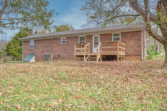 rear view of property featuring a deck