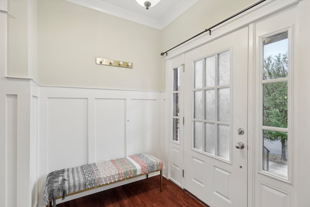 foyer featuring crown molding and dark wood-type flooring