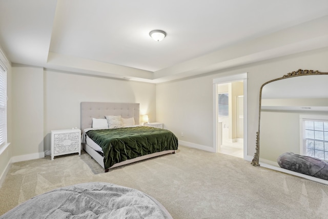 carpeted bedroom with ensuite bathroom