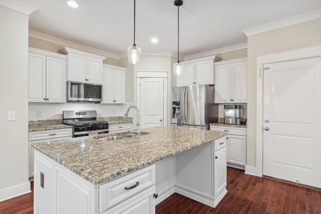 kitchen featuring sink, white cabinetry, an island with sink, and appliances with stainless steel finishes