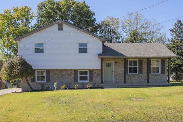 split level home with a front lawn