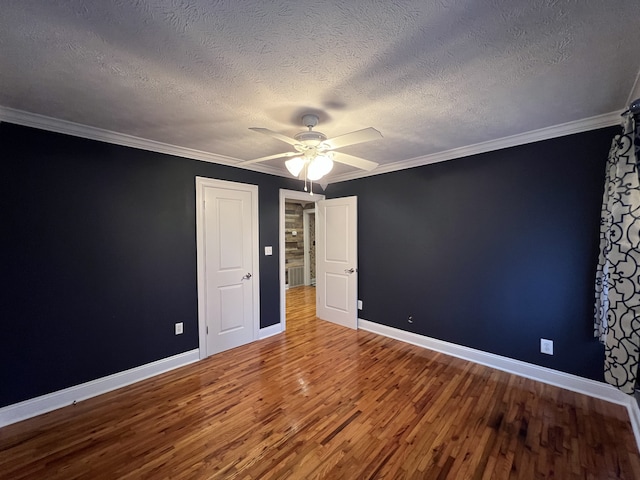 unfurnished bedroom featuring hardwood / wood-style floors, ceiling fan, crown molding, and a textured ceiling