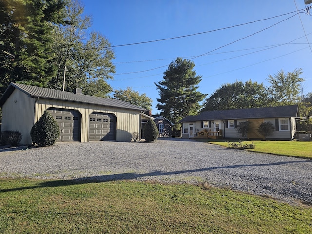 garage featuring a yard