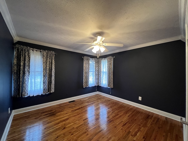 unfurnished room with ceiling fan, wood-type flooring, crown molding, and a textured ceiling