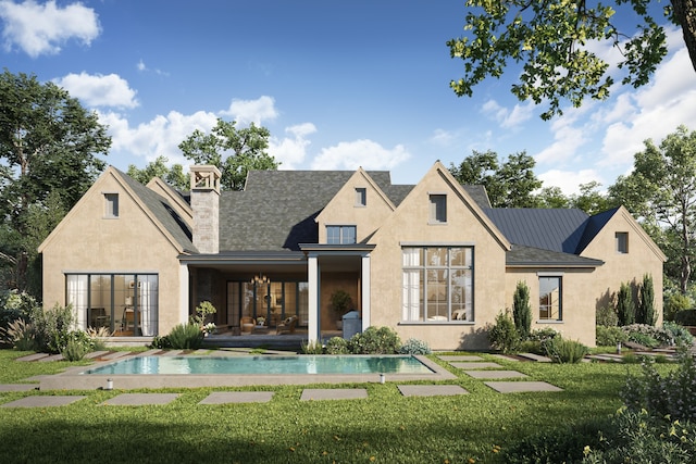 rear view of property featuring a patio area and a lawn