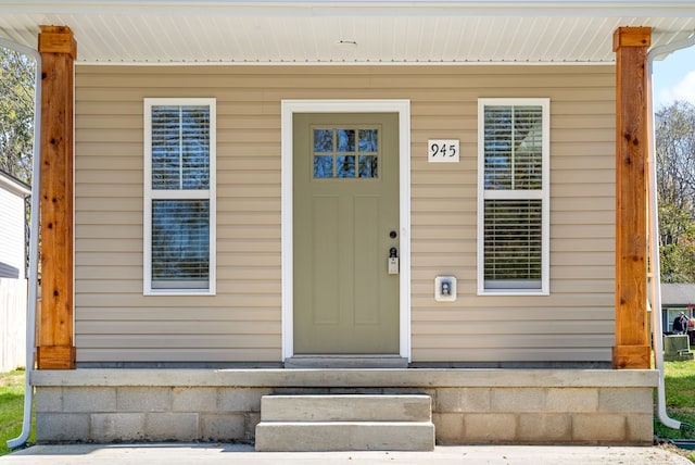 doorway to property featuring covered porch