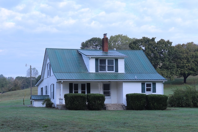 exterior space with a lawn and a porch