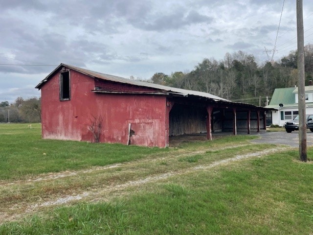 view of outbuilding with a lawn