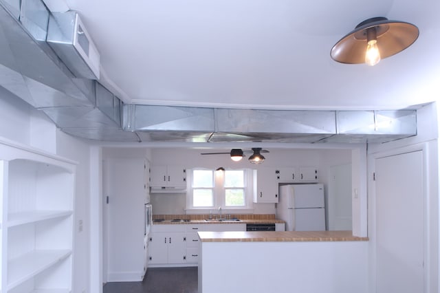 kitchen with backsplash, sink, white refrigerator, dishwasher, and white cabinetry