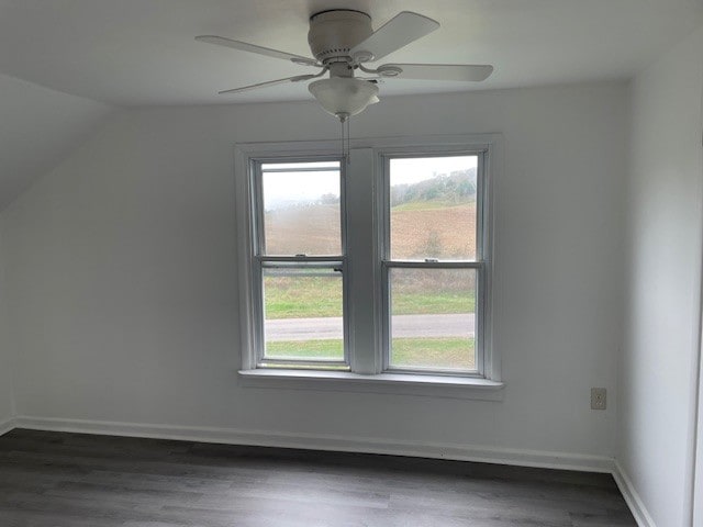 bonus room with ceiling fan, dark hardwood / wood-style flooring, and vaulted ceiling