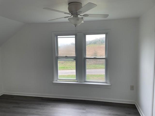 60 Riddle Rd, Shelbyville, TN 37160 - additional living space featuring plenty of natural light, vaulted ceiling, dark wood-type flooring, and a ceiling fan