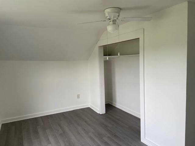 60 Riddle Rd, Shelbyville, TN 37160 - unfurnished bedroom with dark wood-style floors, vaulted ceiling, a closet, and a ceiling fan