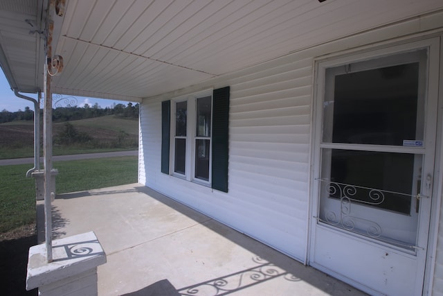 view of patio featuring a porch