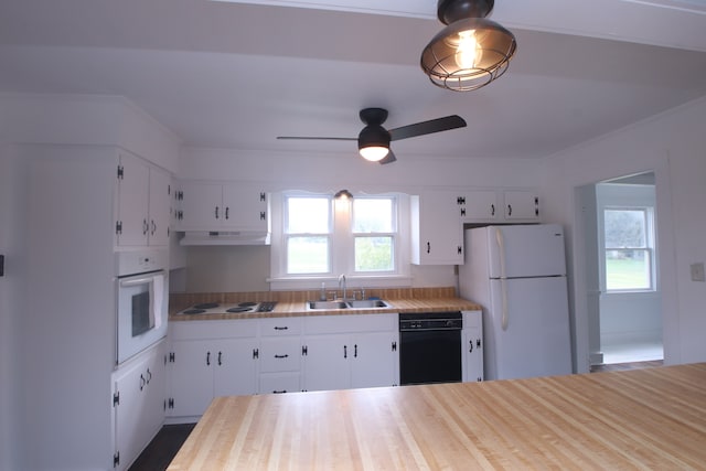 kitchen with sink, white cabinets, and white appliances