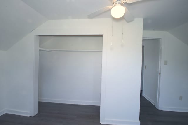 additional living space featuring ceiling fan, dark wood-type flooring, and vaulted ceiling