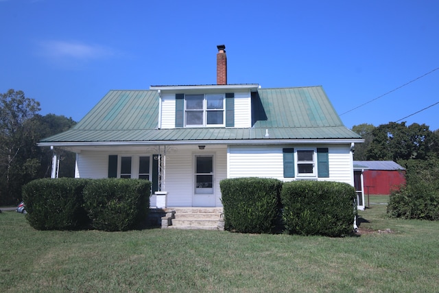 view of front of home featuring a front yard and a porch