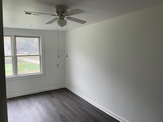 60 Riddle Rd, Shelbyville, TN 37160 - spare room featuring a ceiling fan and dark wood-style floors
