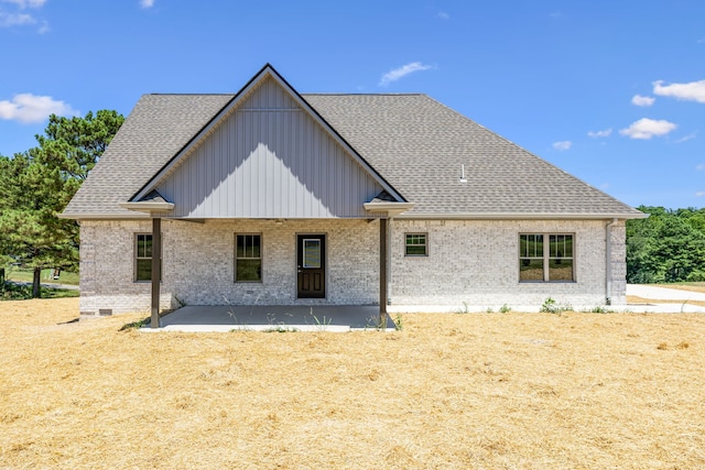 rear view of house featuring a patio