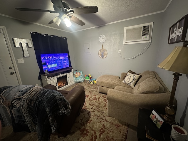 living room with an AC wall unit, crown molding, ceiling fan, and a textured ceiling