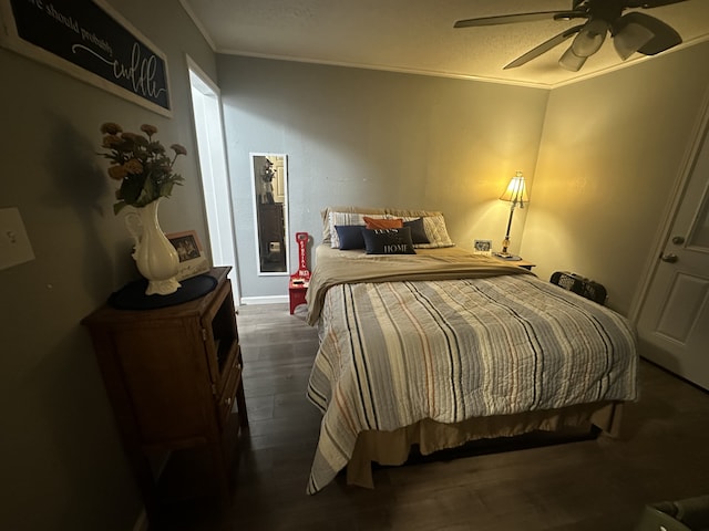 bedroom featuring ceiling fan, crown molding, and dark hardwood / wood-style floors