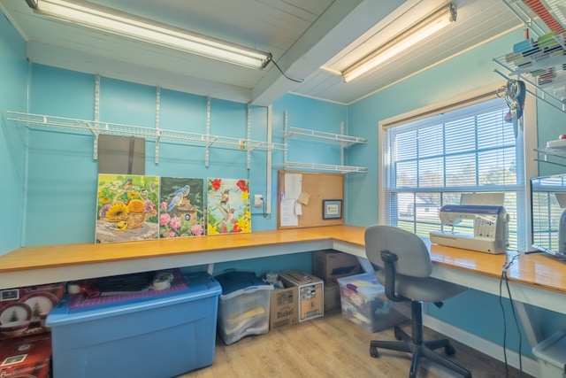 office space with hardwood / wood-style floors and ornamental molding