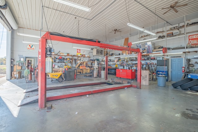 garage featuring a workshop area and ceiling fan