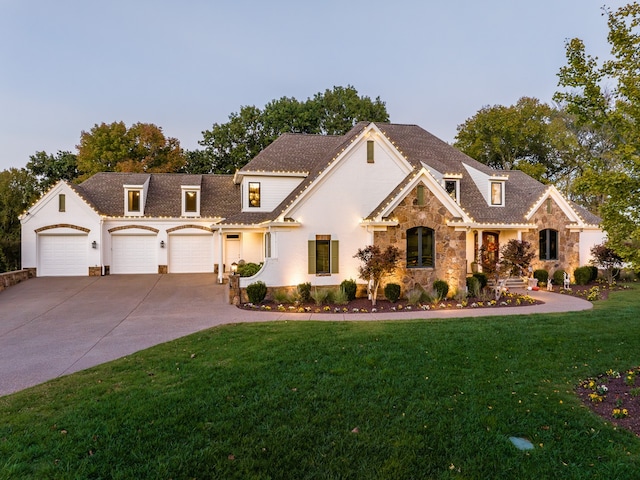 view of front facade with stone siding, concrete driveway, a front lawn, and an attached garage