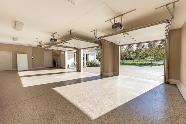 garage featuring baseboards and a garage door opener