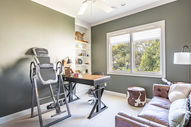 carpeted office featuring crown molding, a ceiling fan, and baseboards