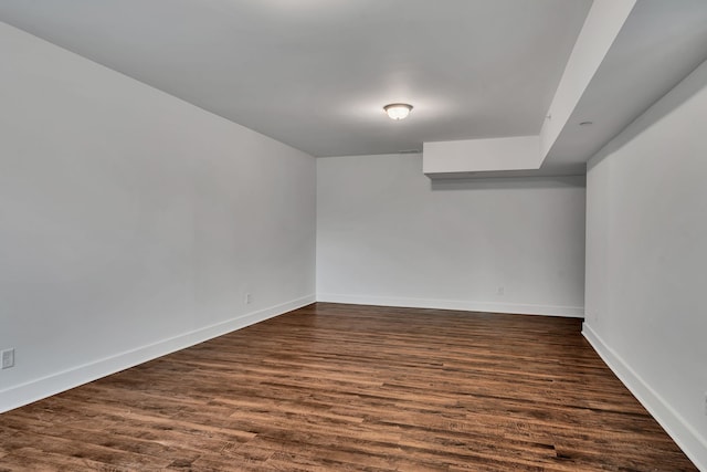 empty room with dark hardwood / wood-style floors