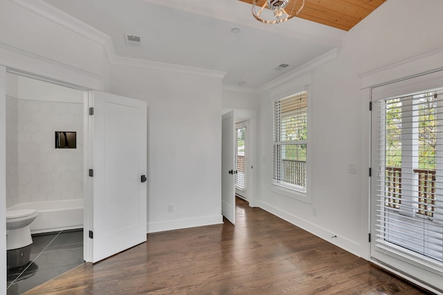 spare room with crown molding, dark wood-type flooring, and wood ceiling