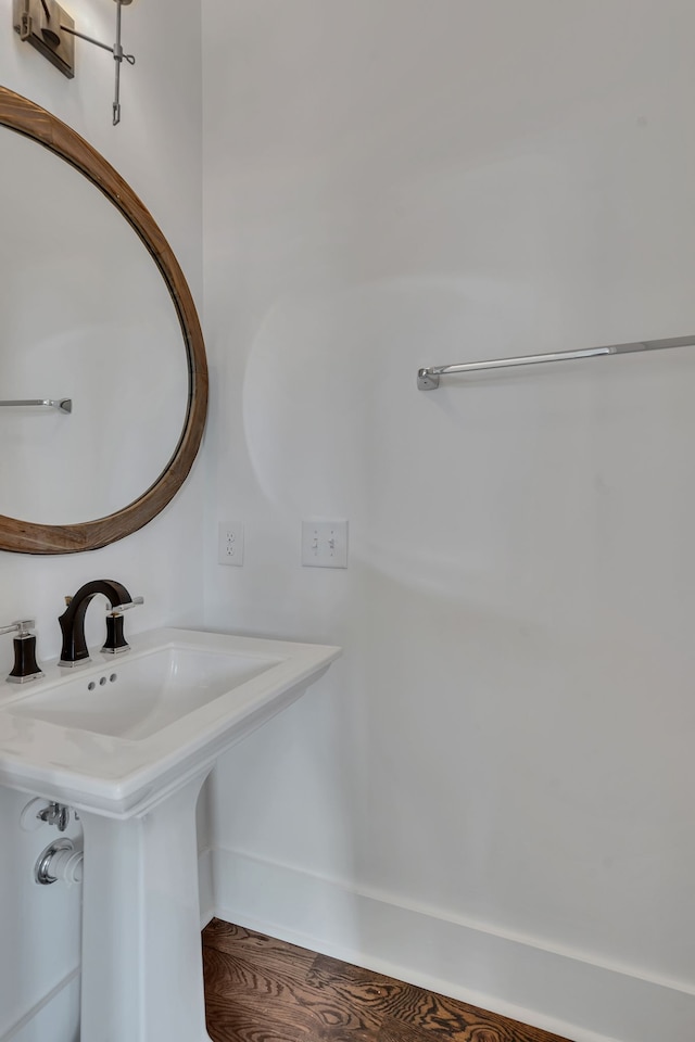 bathroom featuring hardwood / wood-style floors and sink