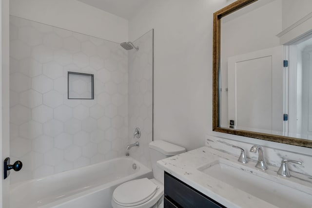 full bathroom featuring toilet, vanity, and tiled shower / bath