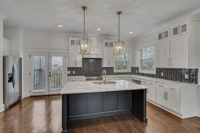 kitchen with white cabinetry, a center island with sink, appliances with stainless steel finishes, custom exhaust hood, and dark hardwood / wood-style floors