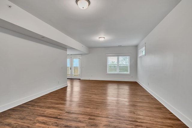 spare room with dark wood-type flooring