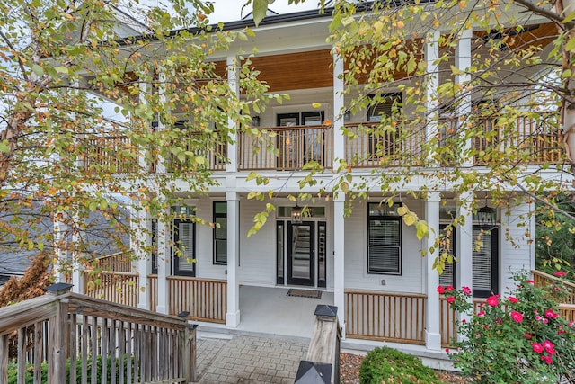 view of front of home with a balcony and a porch