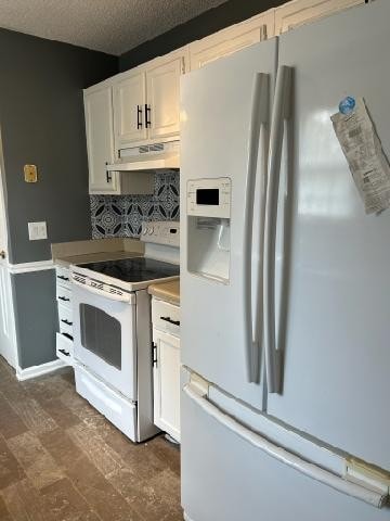 kitchen with white cabinets, white appliances, a textured ceiling, and tasteful backsplash