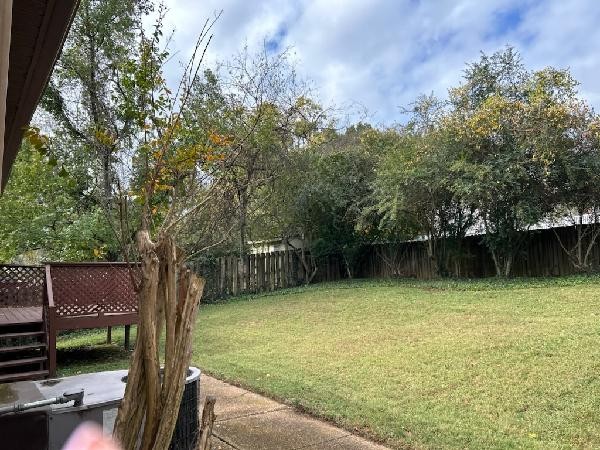 view of yard featuring a wooden deck