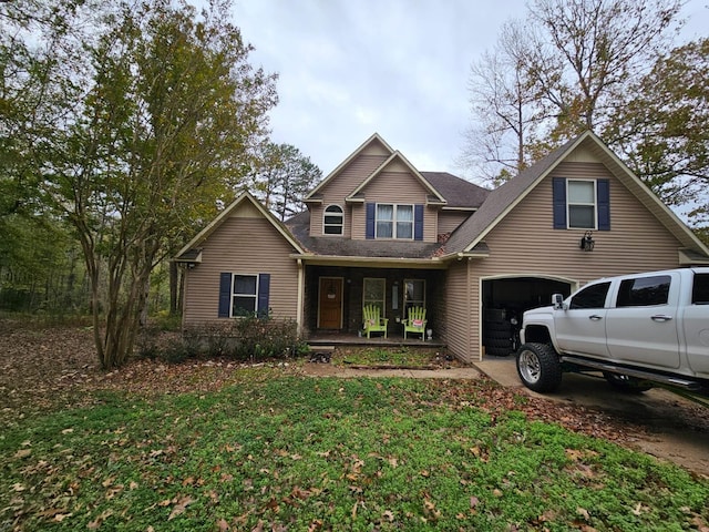 view of front facade with a garage and covered porch