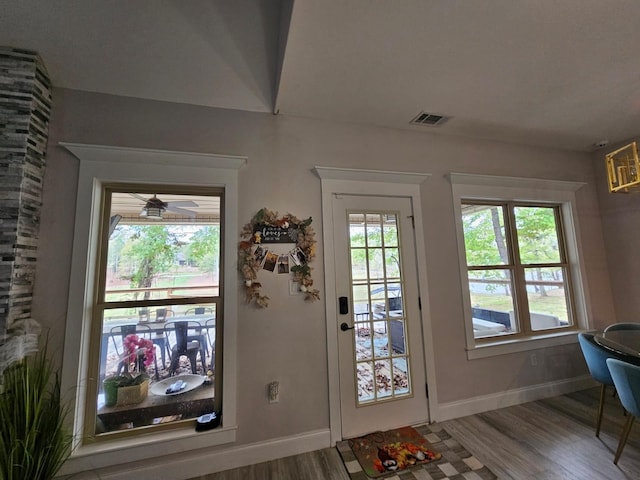 doorway featuring hardwood / wood-style floors and ceiling fan