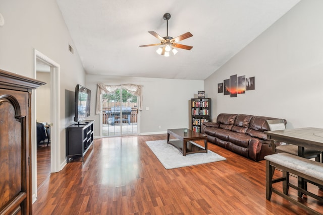 living room with ceiling fan, dark hardwood / wood-style flooring, and high vaulted ceiling